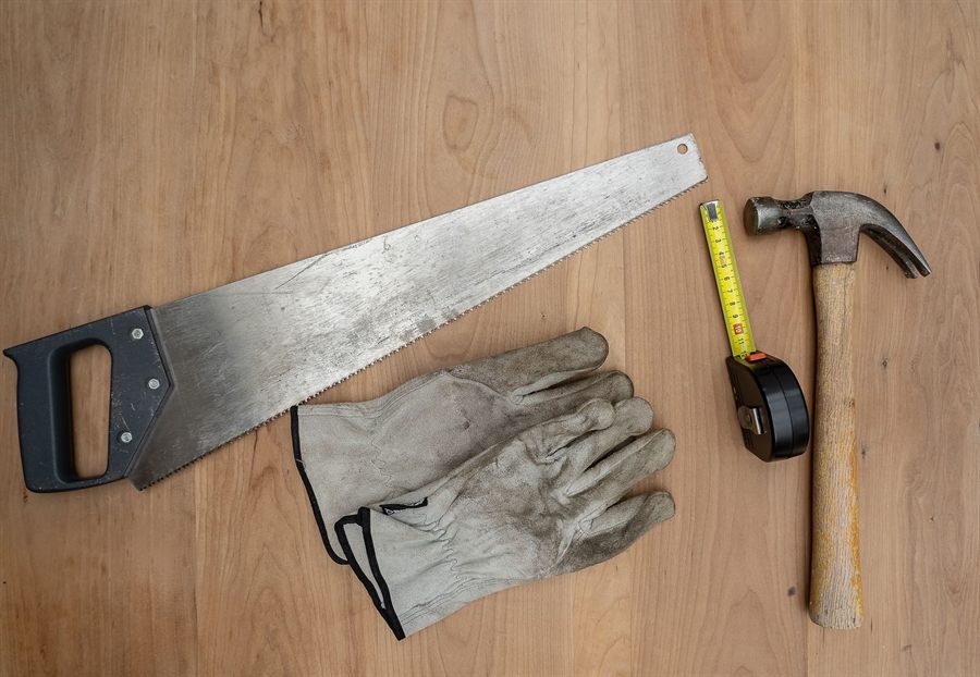 Basic hand tools on a wooden table